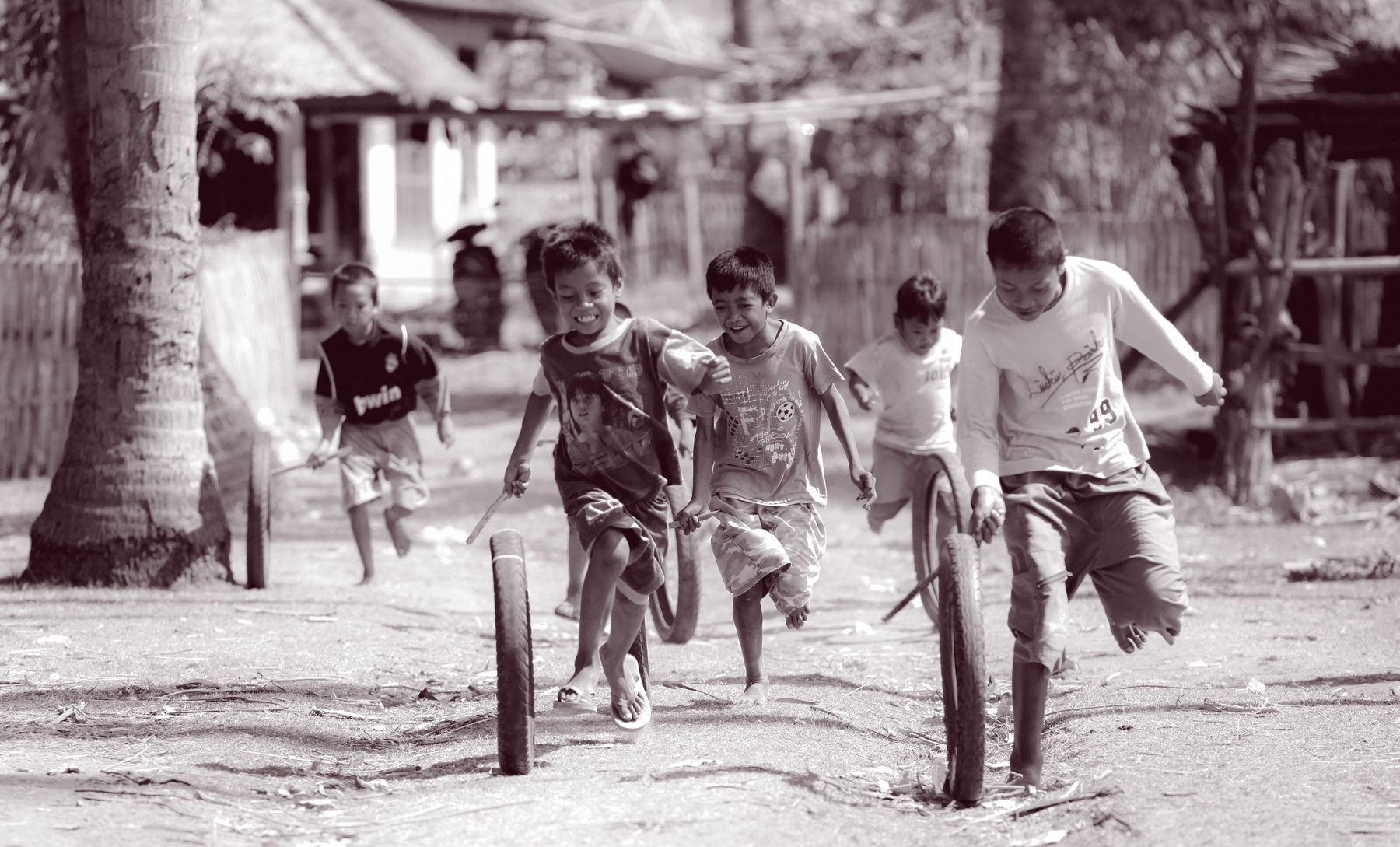 Children running and playing in a community in the Philippines